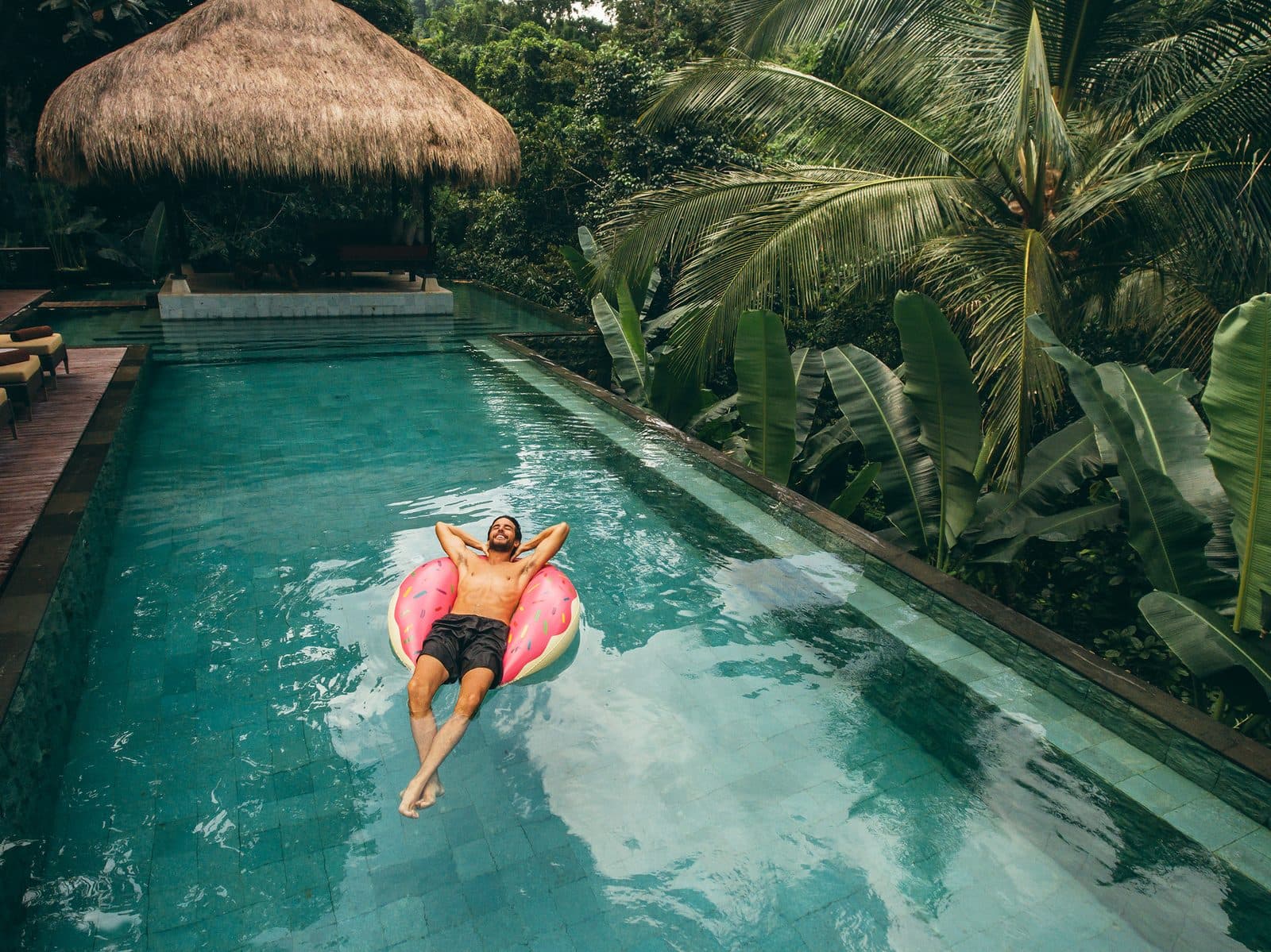 Resort pool framed by palms