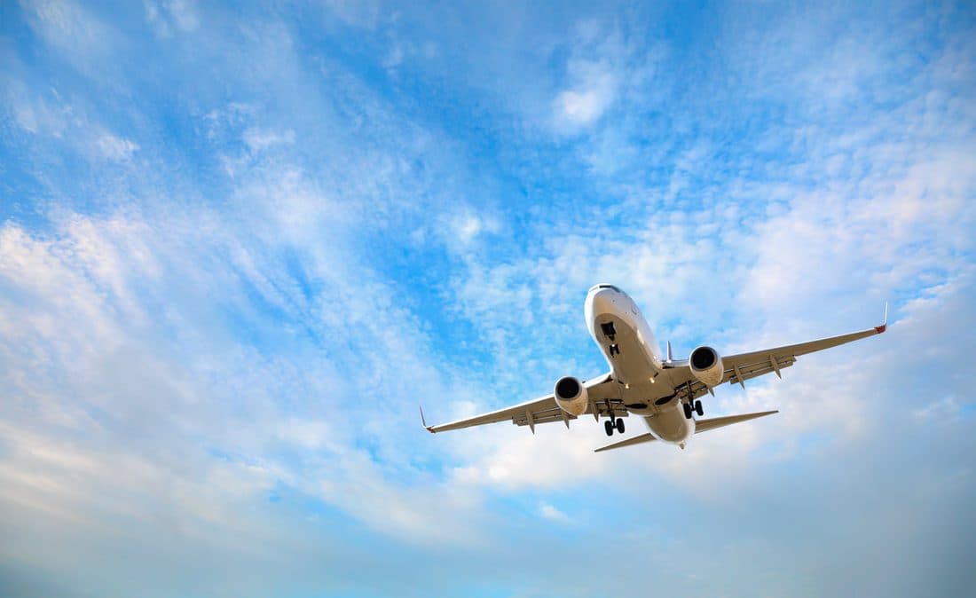 Aircraft climbing against a blue sky
